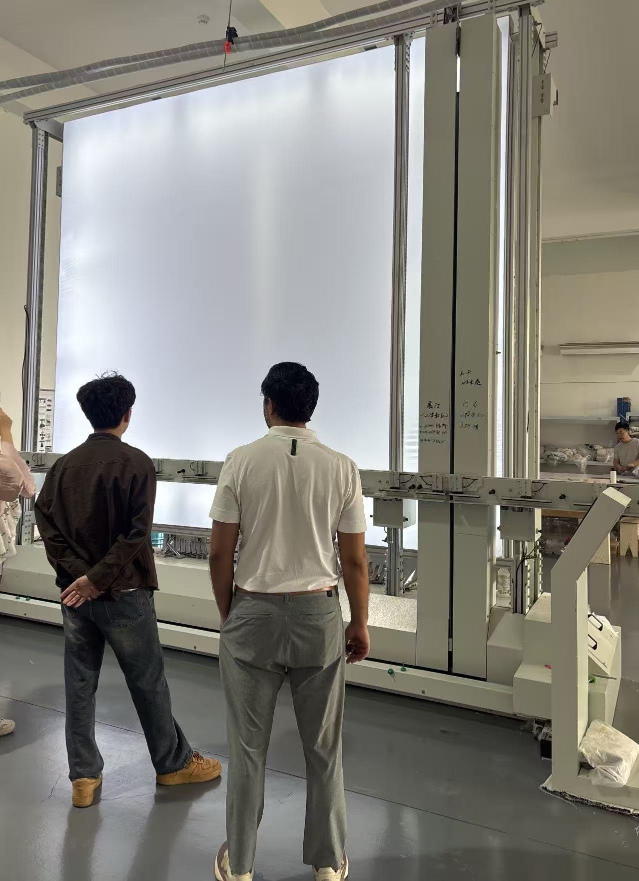 Buyer reviewing production capability inside a factory in China