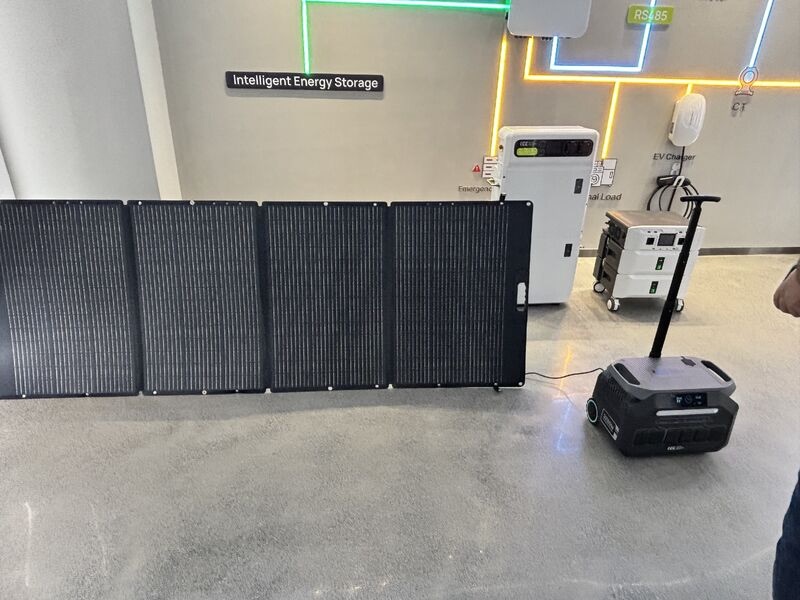 Portable power station connected to a foldable solar panel in an energy storage showroom